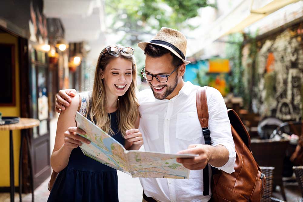 Tourists with map exploring city streets